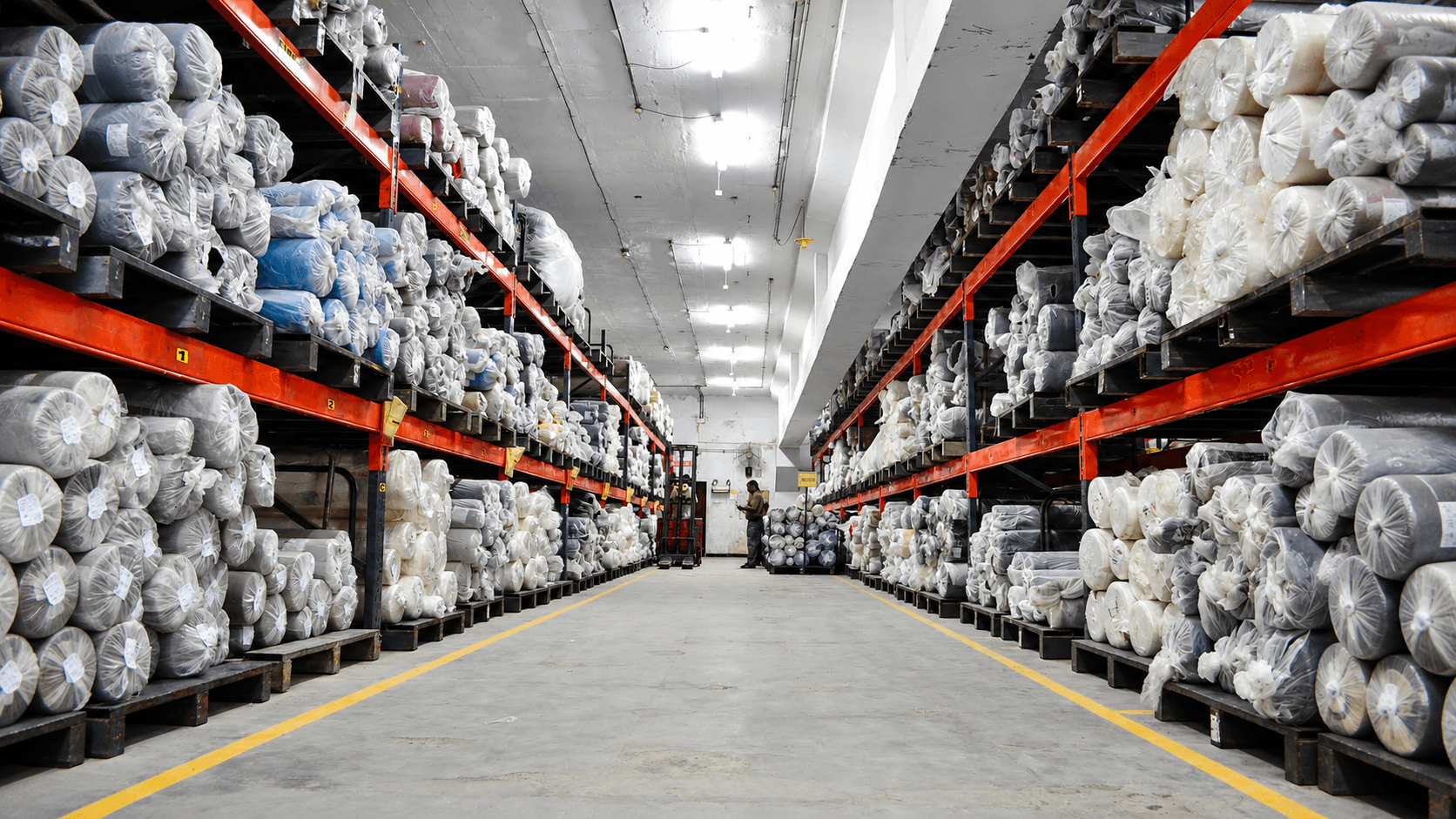 Rows of sewing machines on the factory floor