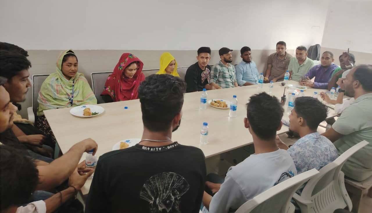 Staff sharing a meal in the community dining hall